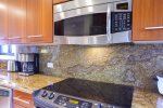 The kitchen features all stainless steel appliances